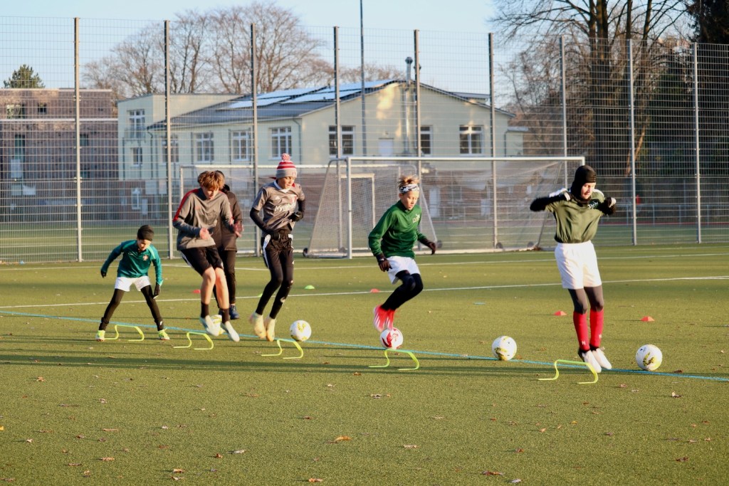 soccer players doing additional training and agility work